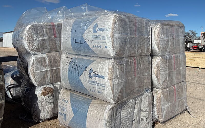 Insulation stacked outside, ready for delivery at Johnson Wholesale Lumber.