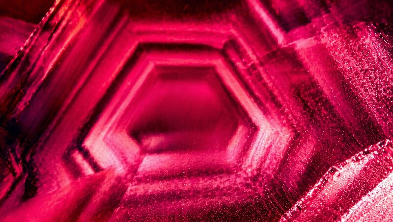 A hexagonal cloud results from heat treating this Burmese ruby from Mogok. 