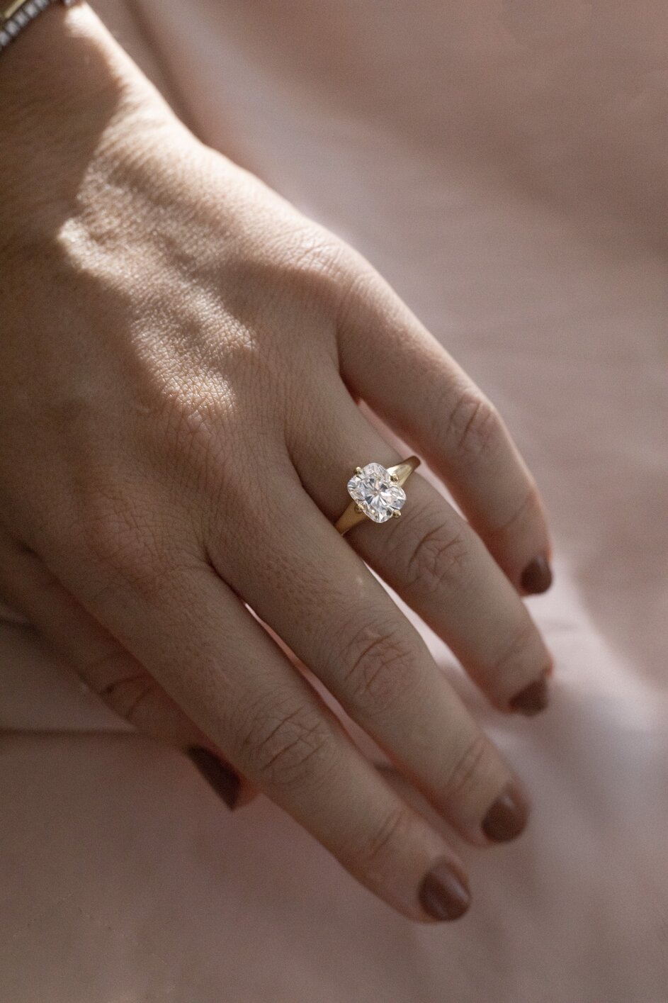 yellow gold, solitaire, elongated cushion engagement ring with a chunky band