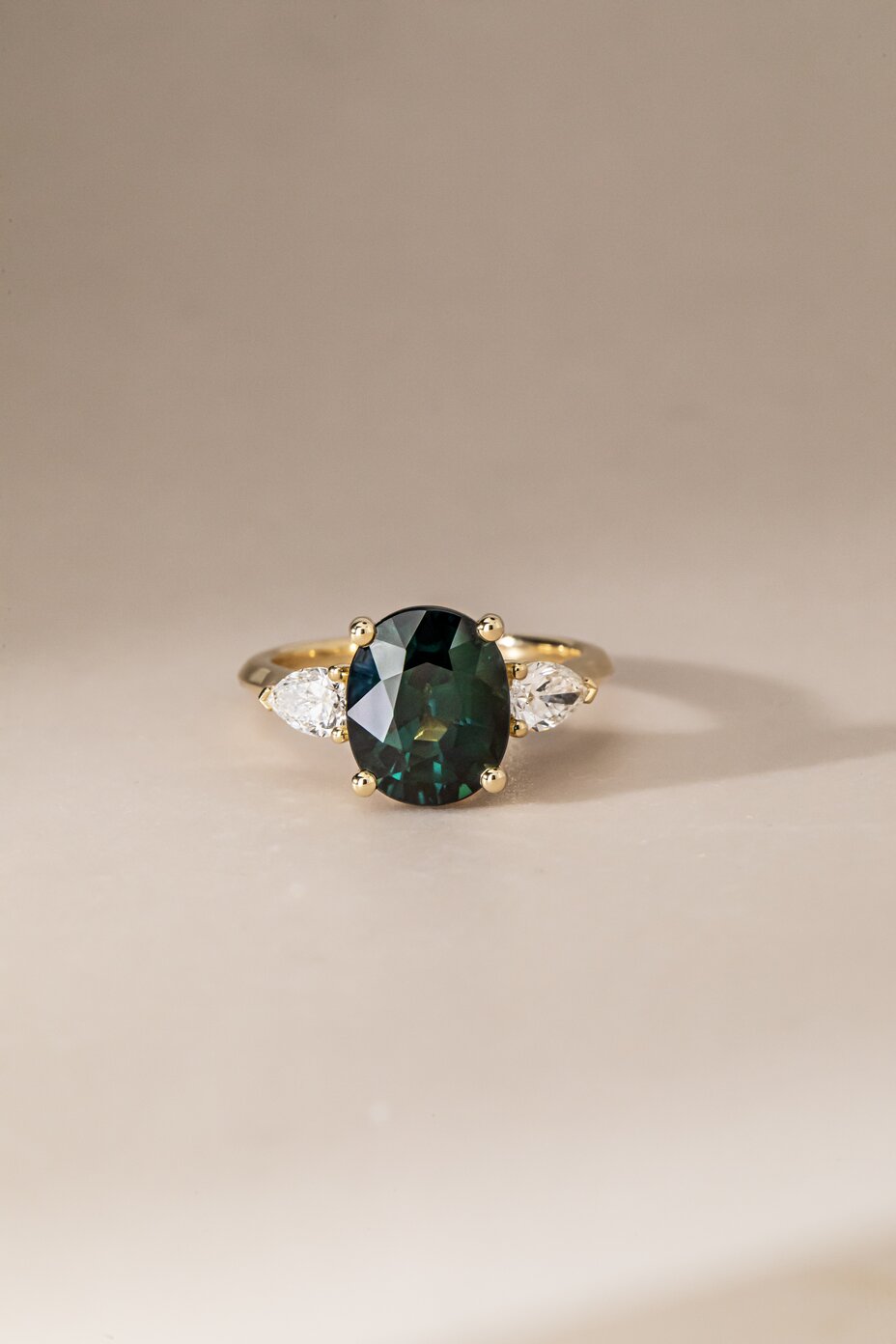 4.57 Carat Oval Teal Sapphire Trilogy Engagement Ring in Yellow Gold - Amaya