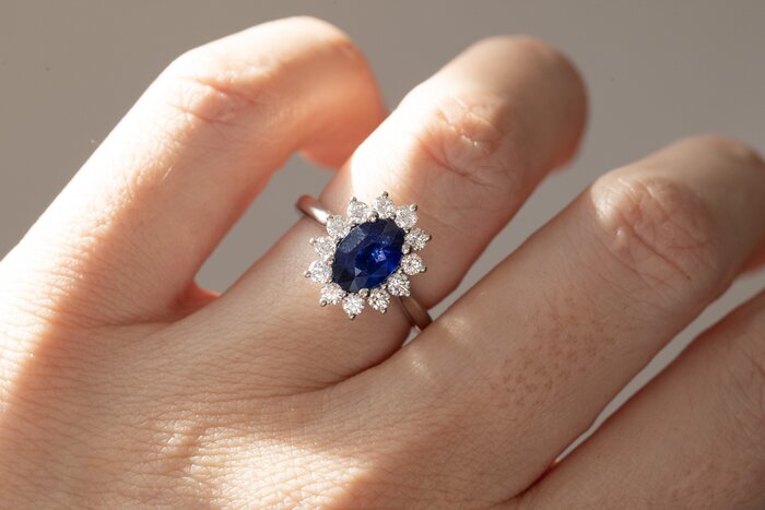 oval blue sapphire cluster engagement ring in platinum Windermere