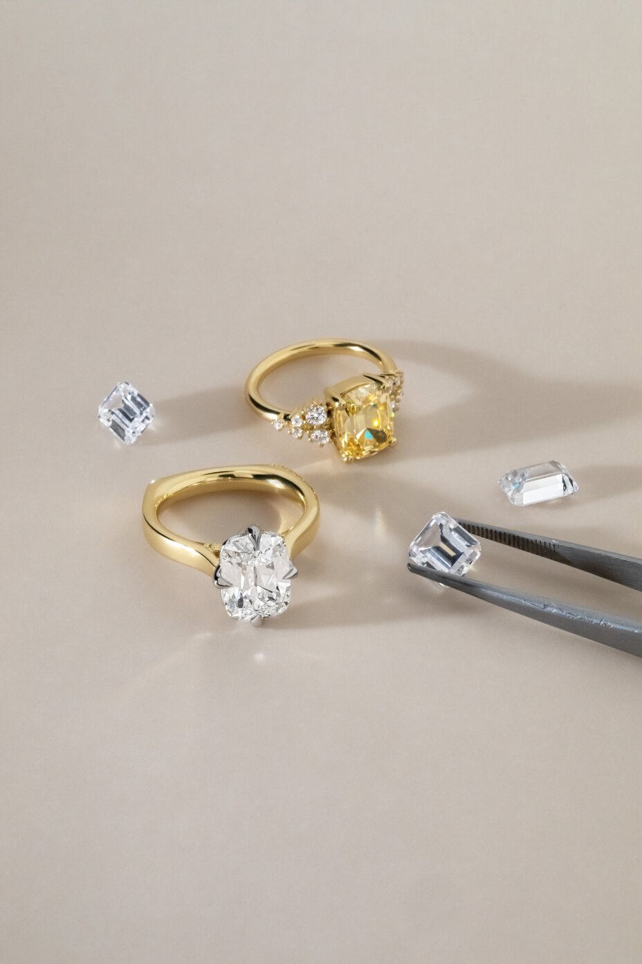 Loose diamonds and yellow gold rings featuring various cuts and styles