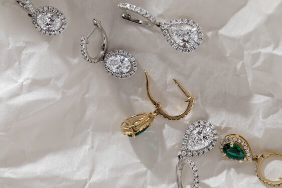 Diamond drop earrings in Yellow gold and platinum featuring various settings and designs