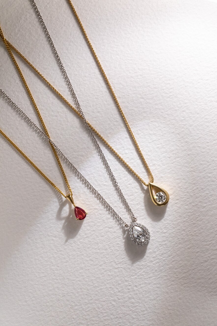 Yellow gold and white gold pendant necklaces featuring diamonds and coloured gemstones