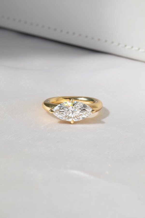 East west marquise cut diamond ring in yellow gold