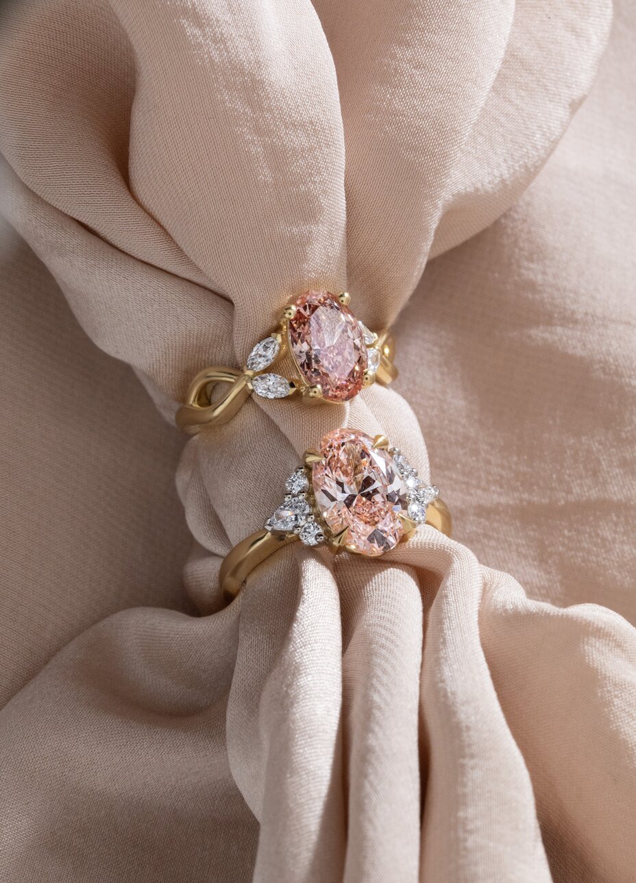 pink oval diamond cluster engagement rings in yellow gold, vina and bespoke design 