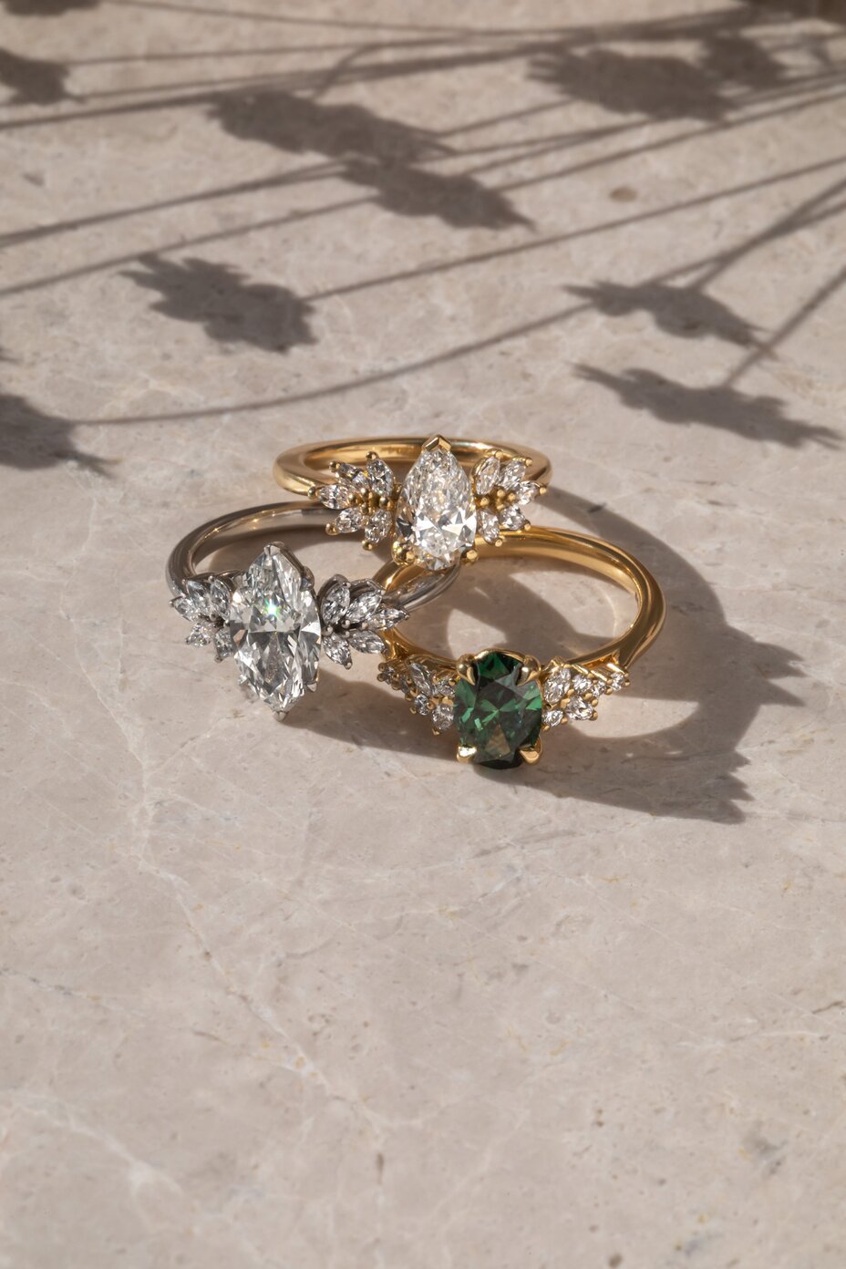 mixed shapes and metals, diamond and gemstone cluster engagement rings