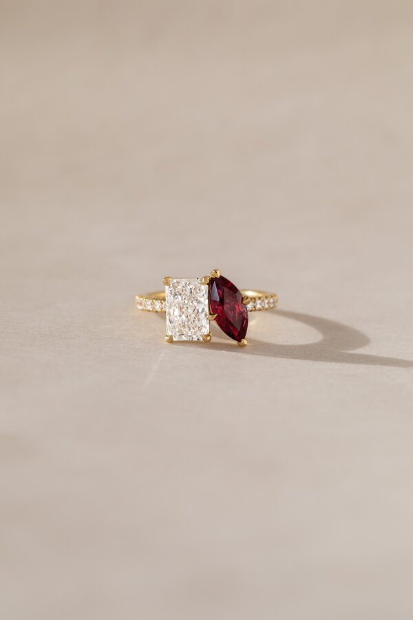 Bespoke toi et moi ring with radiant diamond and marquise ruby.