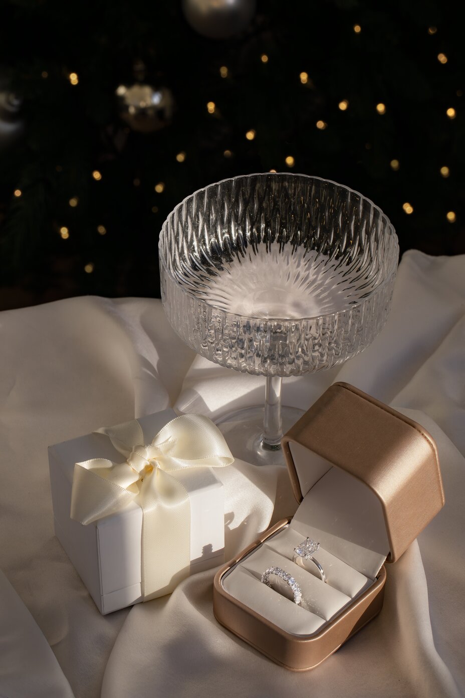 Diamond engagement ring paired with eternity band in premium jewellery gift box.