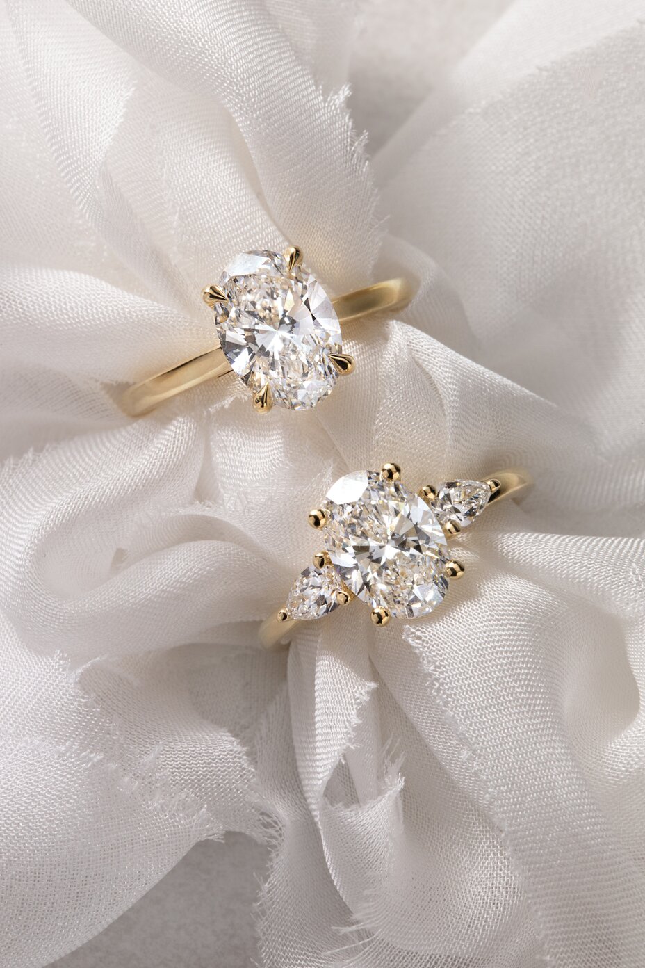 oval cut engagement rings and wedding band in yellow gold