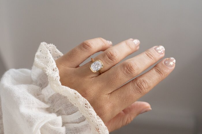 bezel elongated cushion engagement ring in yellow gold Georgia