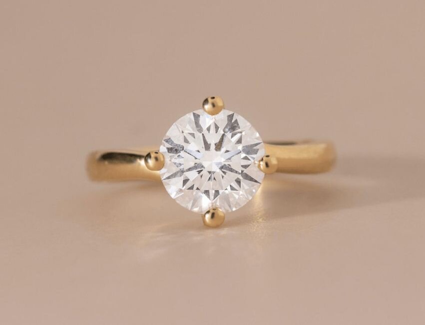 compass set, round solitaire engagement ring in yellow gold