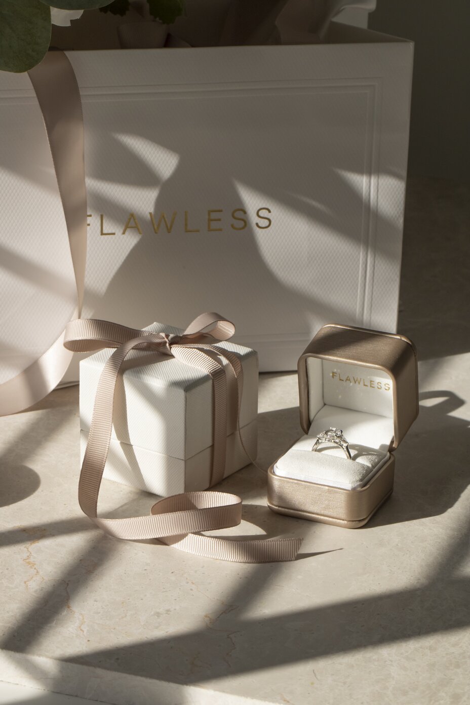 Oval diamond ring presented in luxury jewellery box with elegant gift packaging.