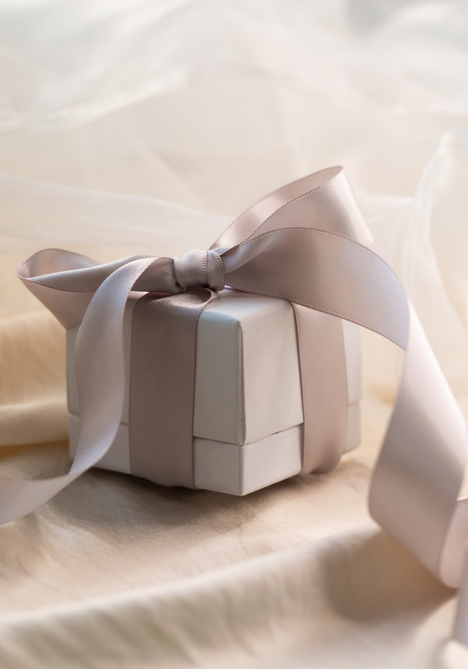 Luxury jewellery gift box wrapped with an elegant satin ribbon for special occasions.