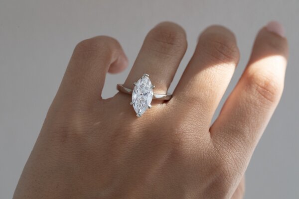 marquise solitaire engagement ring in platinum with six claws