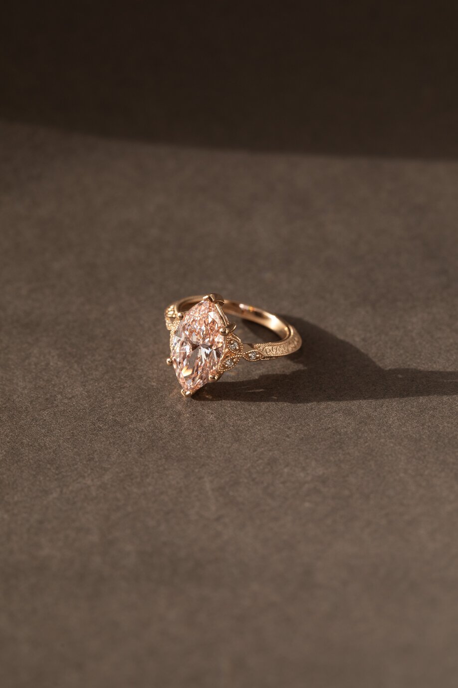 vintage pink marquise engagement ring in rose gold with round side stones and engraved band feis 