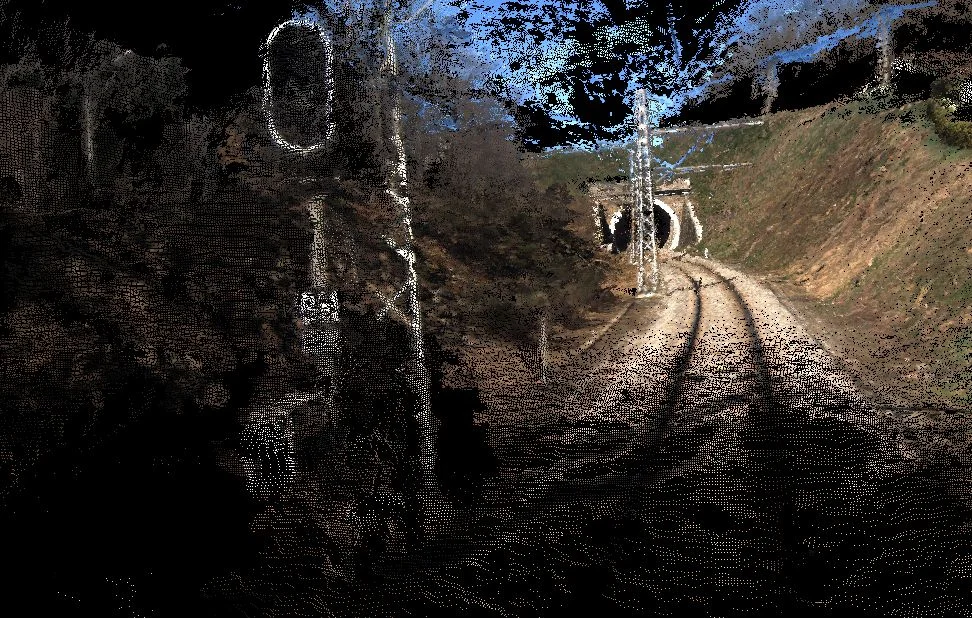 Railway signal and track reconstructed as a 3D point cloud near a tunnel