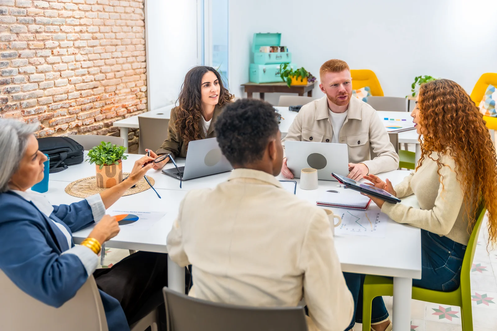 A team working together around a table during a planning session