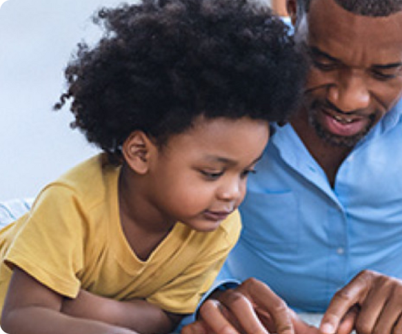 A father and daughter reading book
