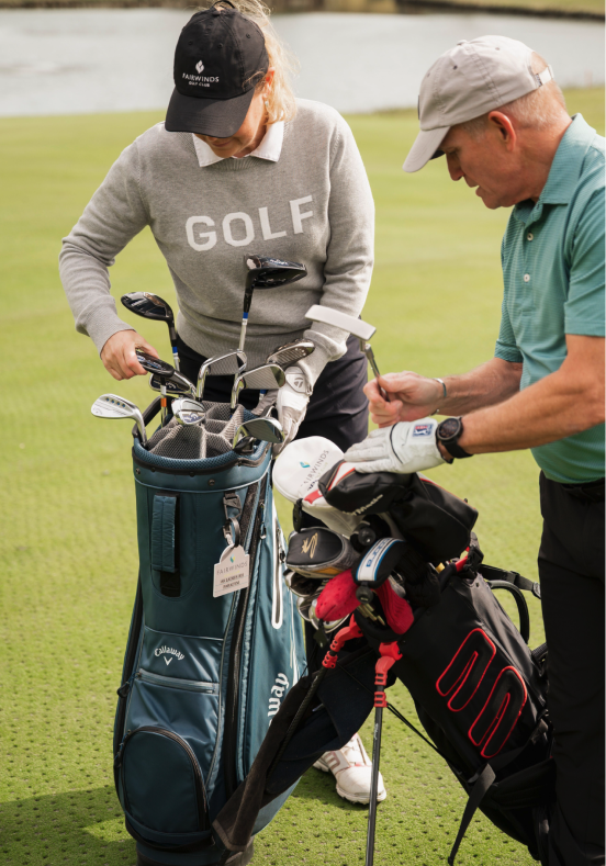 Golf players with golf bags