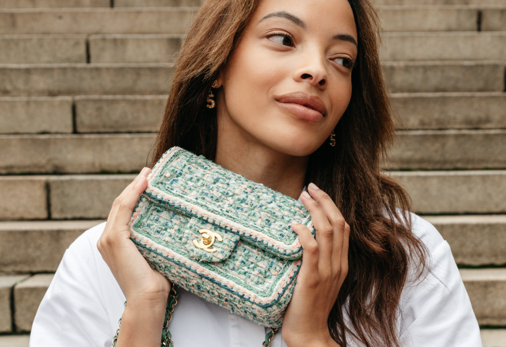 Woman holding a luxury handbag.