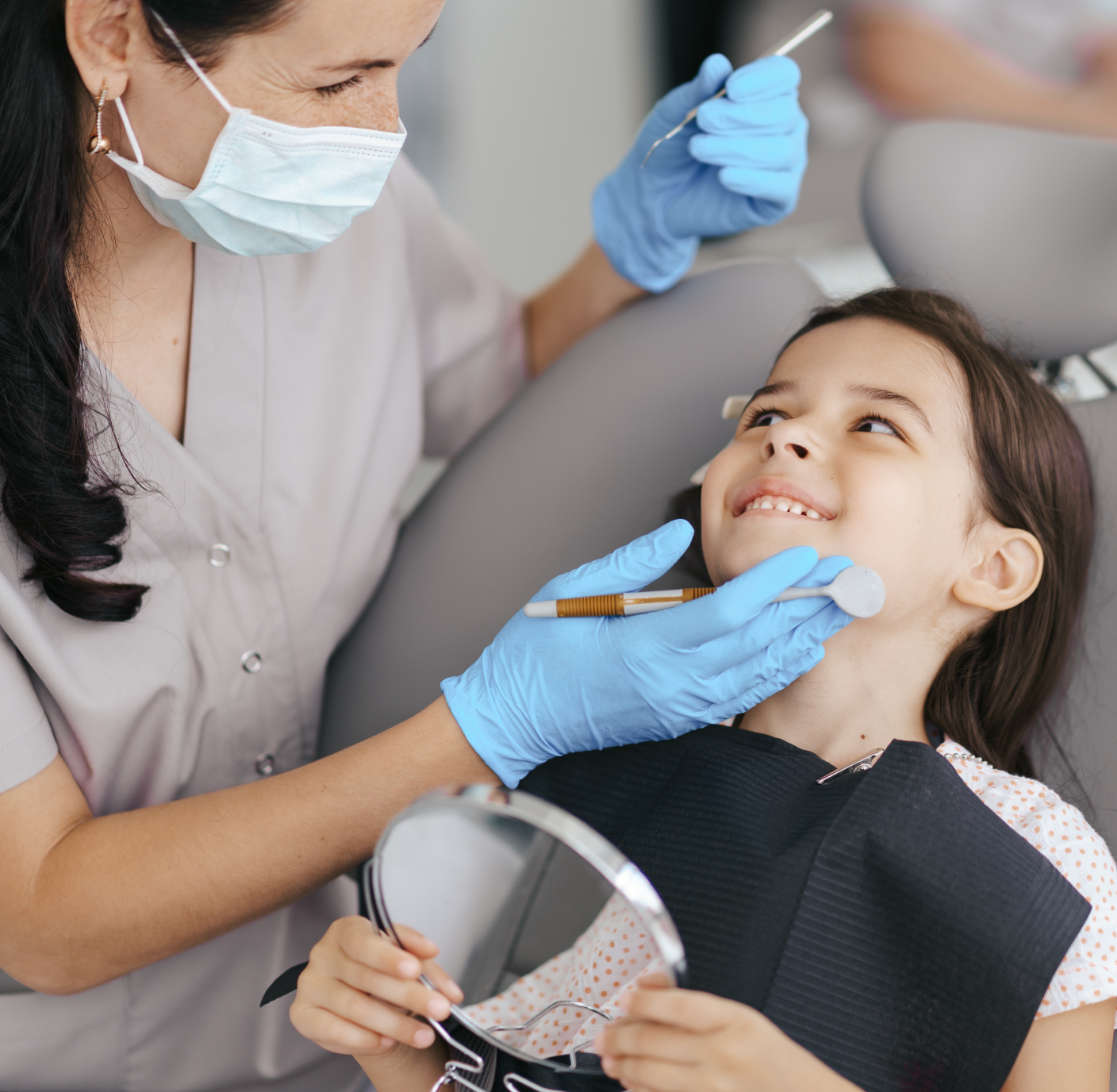 Dentist examining patient's teeth