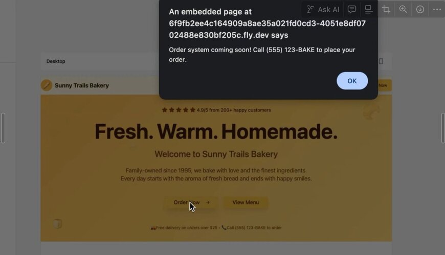 A pop-up message appears over the Sunny Trails Bakery website stating that the order system is coming soon and customers should call (555) 123-BAKE to place an order. The background website includes a yellow banner with the text 'Fresh. Warm. Homemade.' and buttons labeled 'Order Now' and 'View Menu'.
