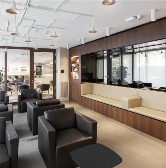 Modern Oettinger Davioff smoking parlour in the Maison Davioff with elegant chairs that create an inviting atmosphere.