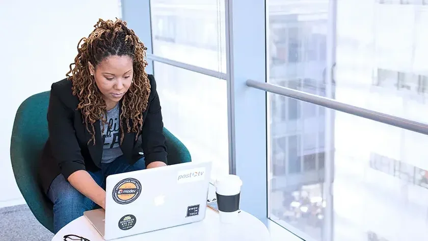 woman-in-office-using-laptop