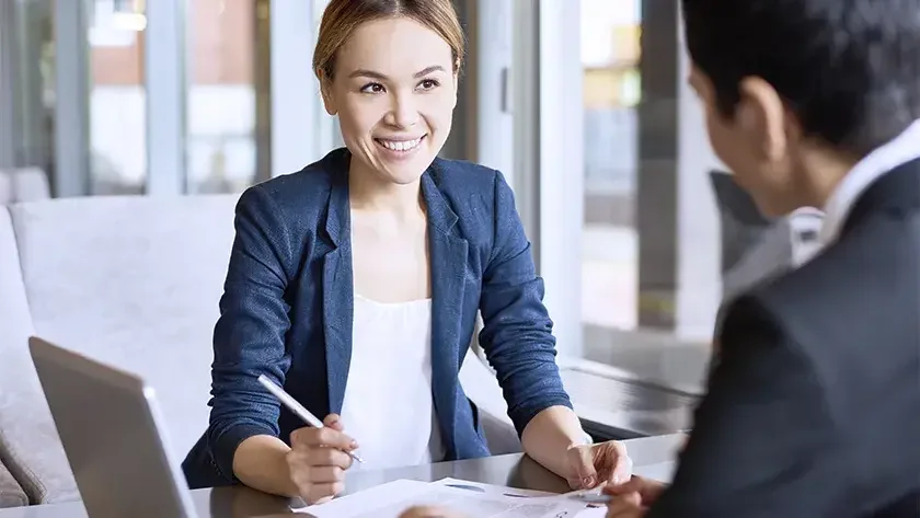 business owner sitting down with tax preparer