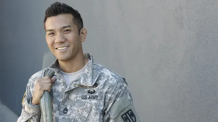 smiling vet coming home in uniform