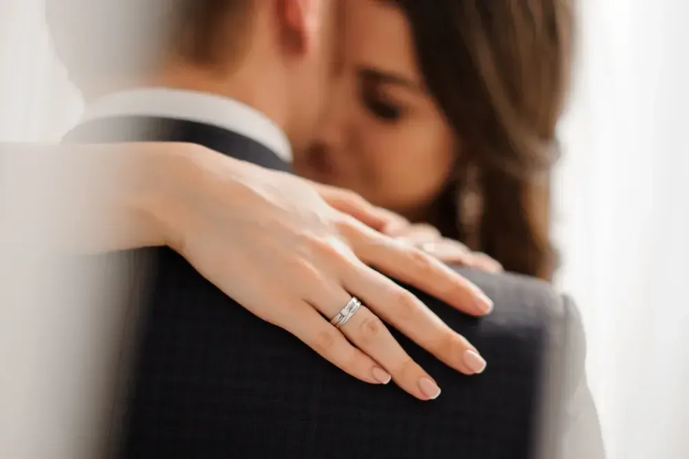 A newly married couple embraces after the ceremony.