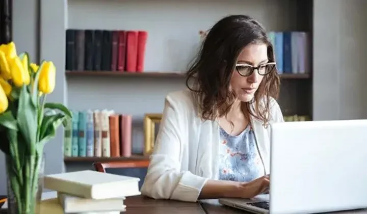 Woman typing on laptop