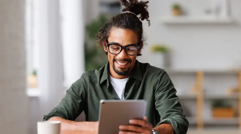 A New Jersey business owner conducts a business search on his tablet.