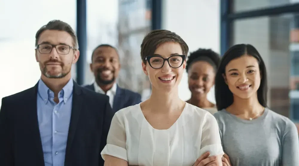 Five lawyers—three women and two men of varying ethnic backgrounds—stand together. Learn which type of lawyer can provide the support you need. 