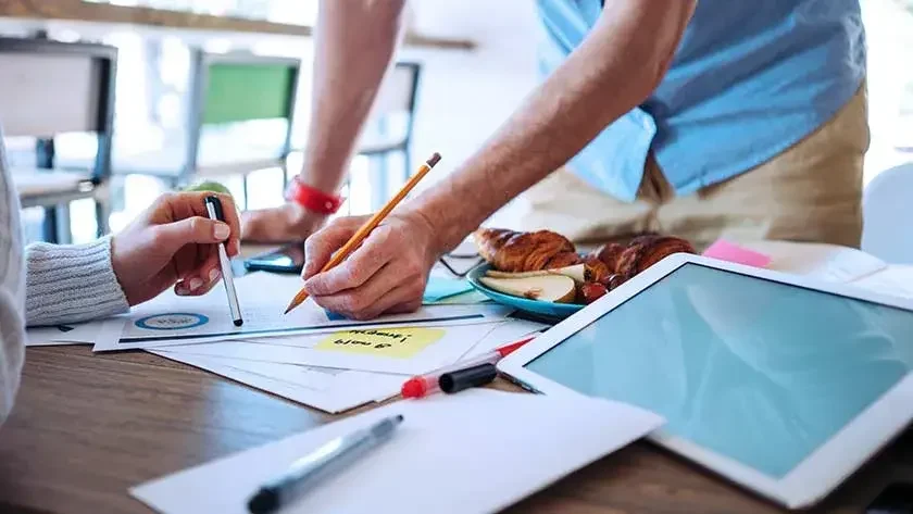 man and woman at home discussing business 