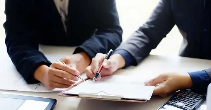 Two business men reviewing plans