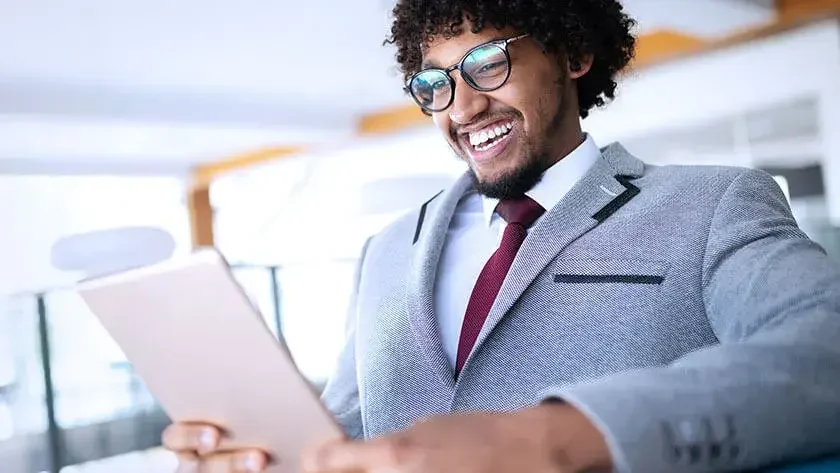 ​​​​happy business man wearing grey suit 