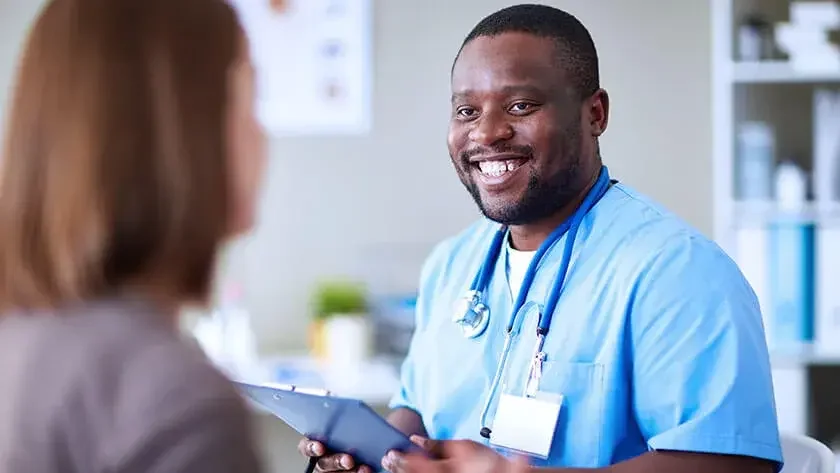 nurse smiling at patient 