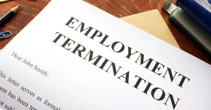 Employment termination letter on wooden desk