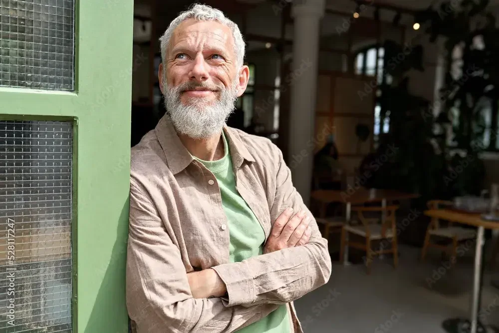 A Nevada restaurant owner takes a break outside and greets customers. If you need to hire a Nevada registered agent for you LLC, it costs around $100-$300 per year.