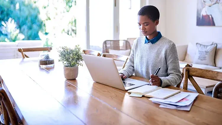 woman-working-at-kitchen-table-home