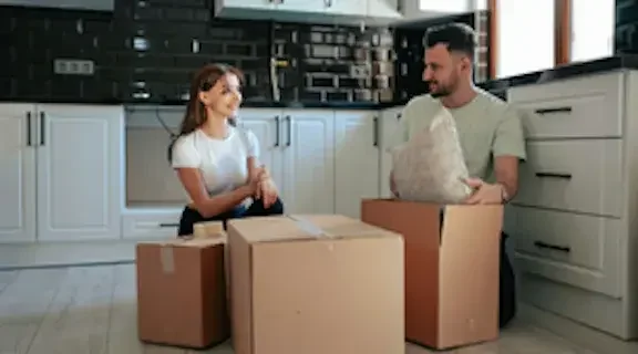 A newly married couple in Nevada unpacks boxes in their new home. In Nevada, community property is any property acquired during a marriage. In Nevada, community property is any property acquired during a marriage.