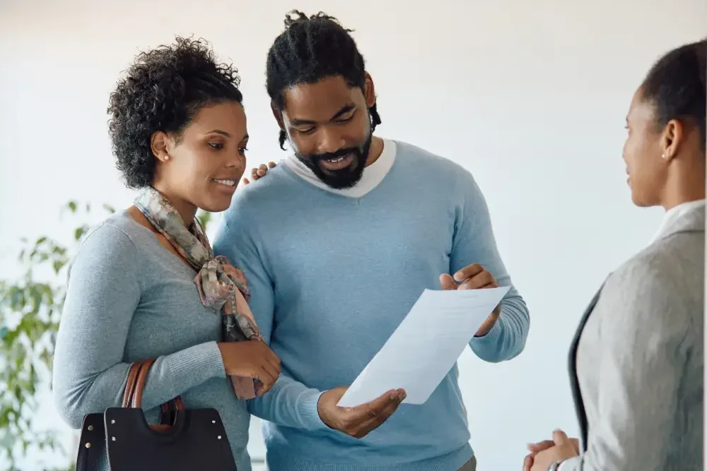 A woman and a man who are engaged meet with a family attorney to prepare their Florida prenuptial agreement.