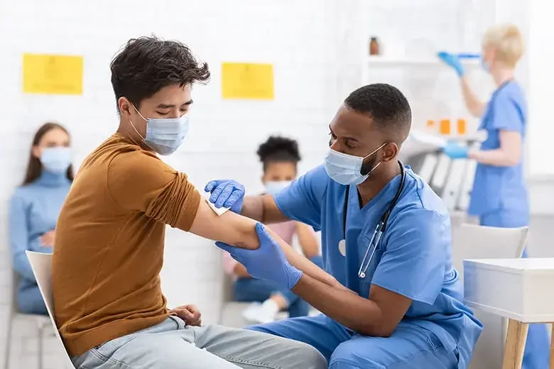 man getting a shot at a medical fair 