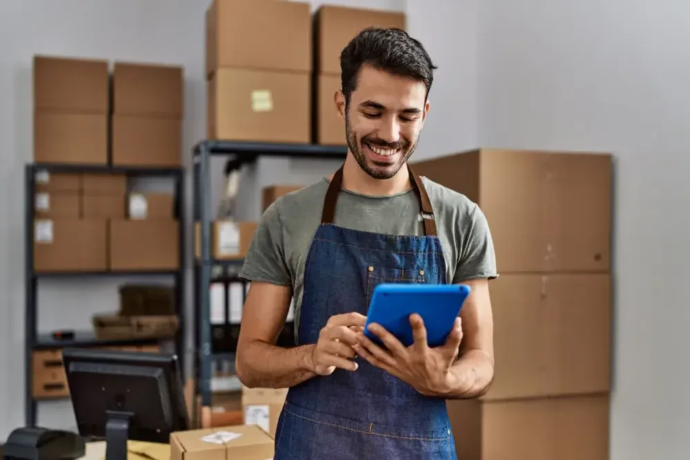 A man who owns a box shop registers his Georgia business online.