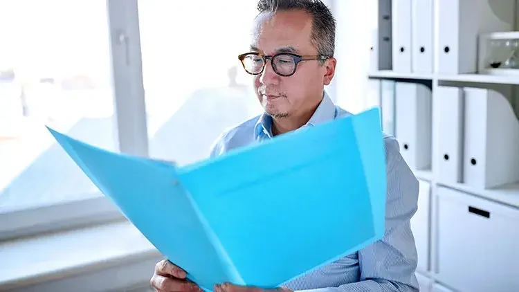 Businessman looking over documents