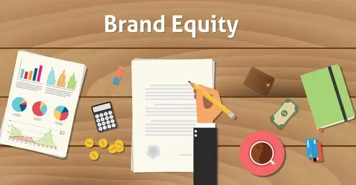 Illustrated hand holding a pencil and signing a document under the words "Brand Equity".  Surrounding the document on the table are a calculator, money, charts, a notebook, and other branding tools.