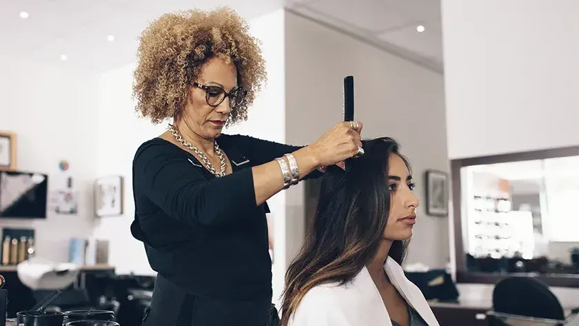 woman sitting in a salon getting her hair done 