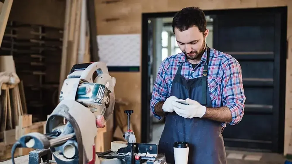 A man works in his woodworking shop in Wyoming. Wyoming is often recommended for non-citizens and non-residents due to its privacy protections and lack of tax.